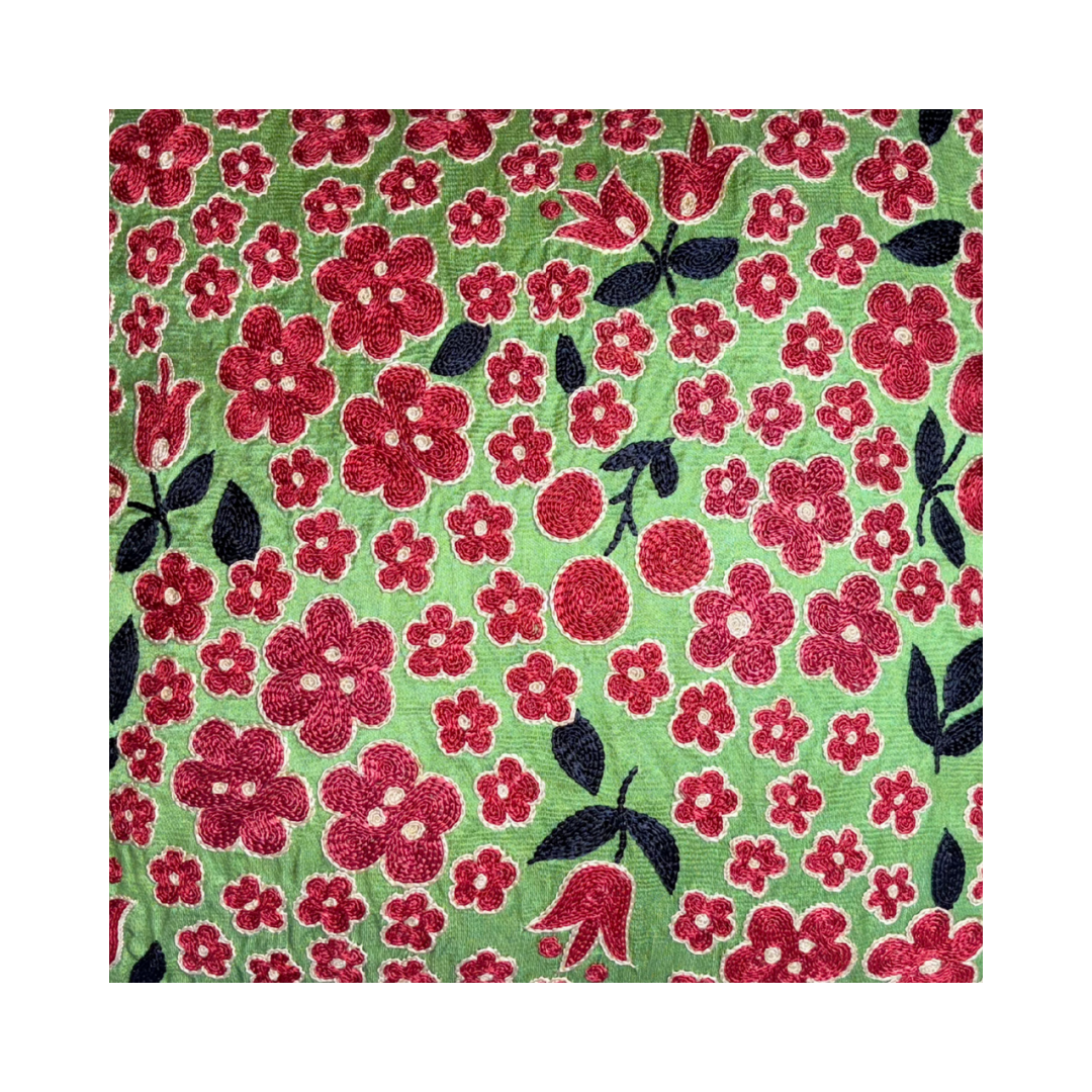 Suzani embroidery textile with traditional floral motifs used in modern home decor