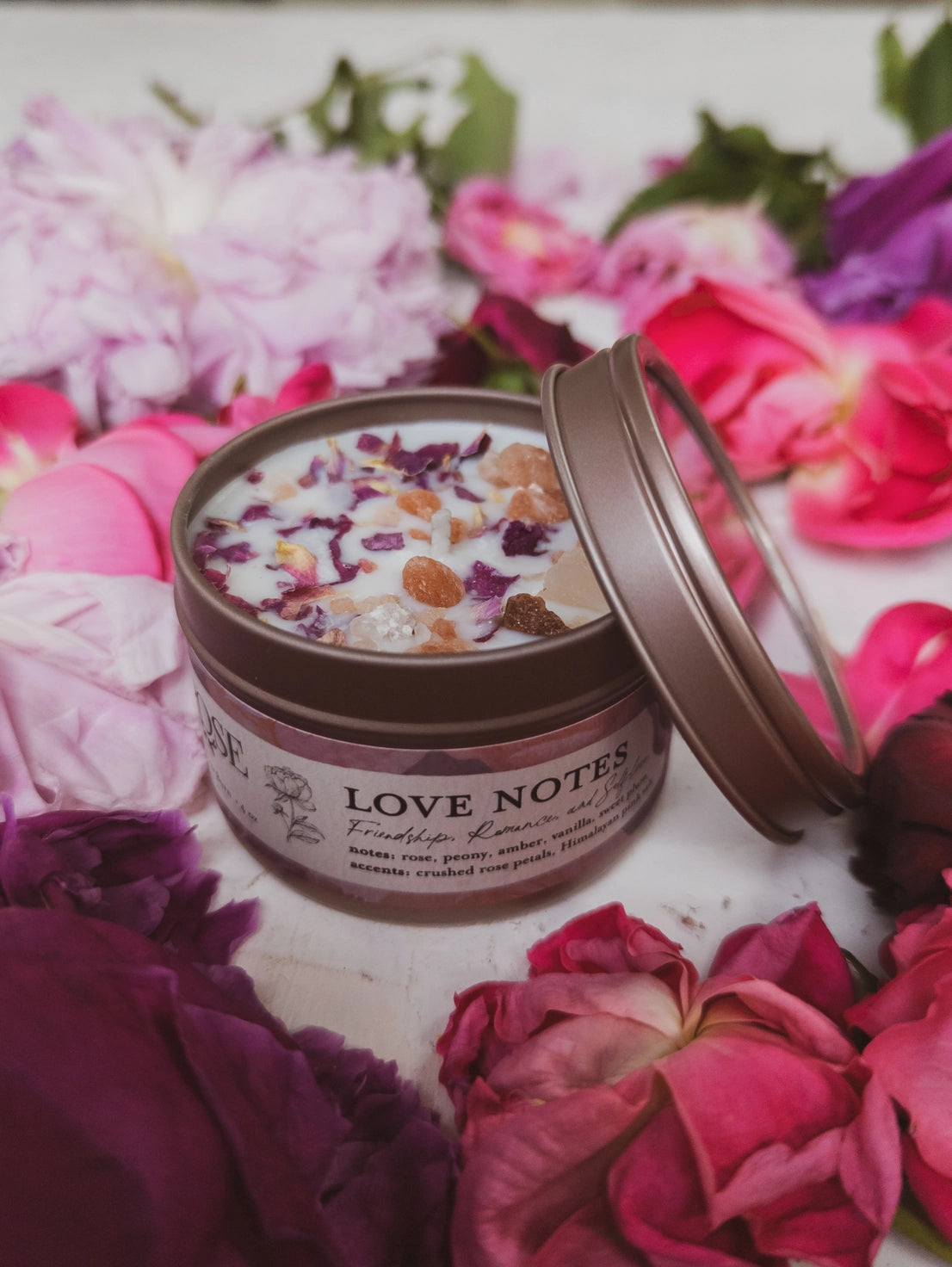 Jar labeled 'Love Notes' surrounded by colorful flowers