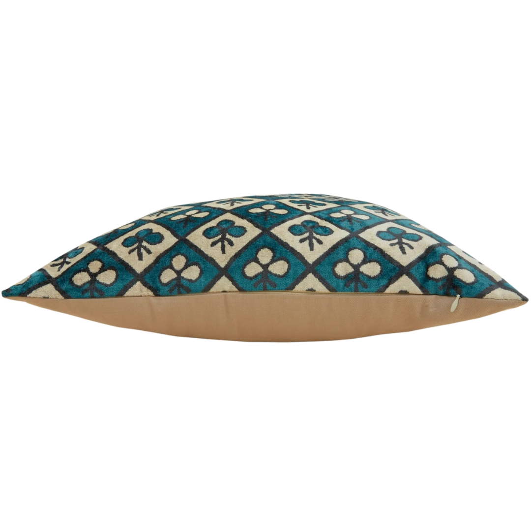 Side view of club-patterned silk velvet pillow cover in neutral and blue tones