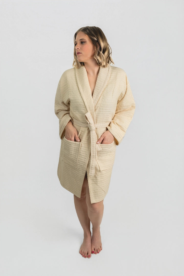 Full-length front view of the Aegean Sand Beige waffle peshtemal bathrobe, worn belted