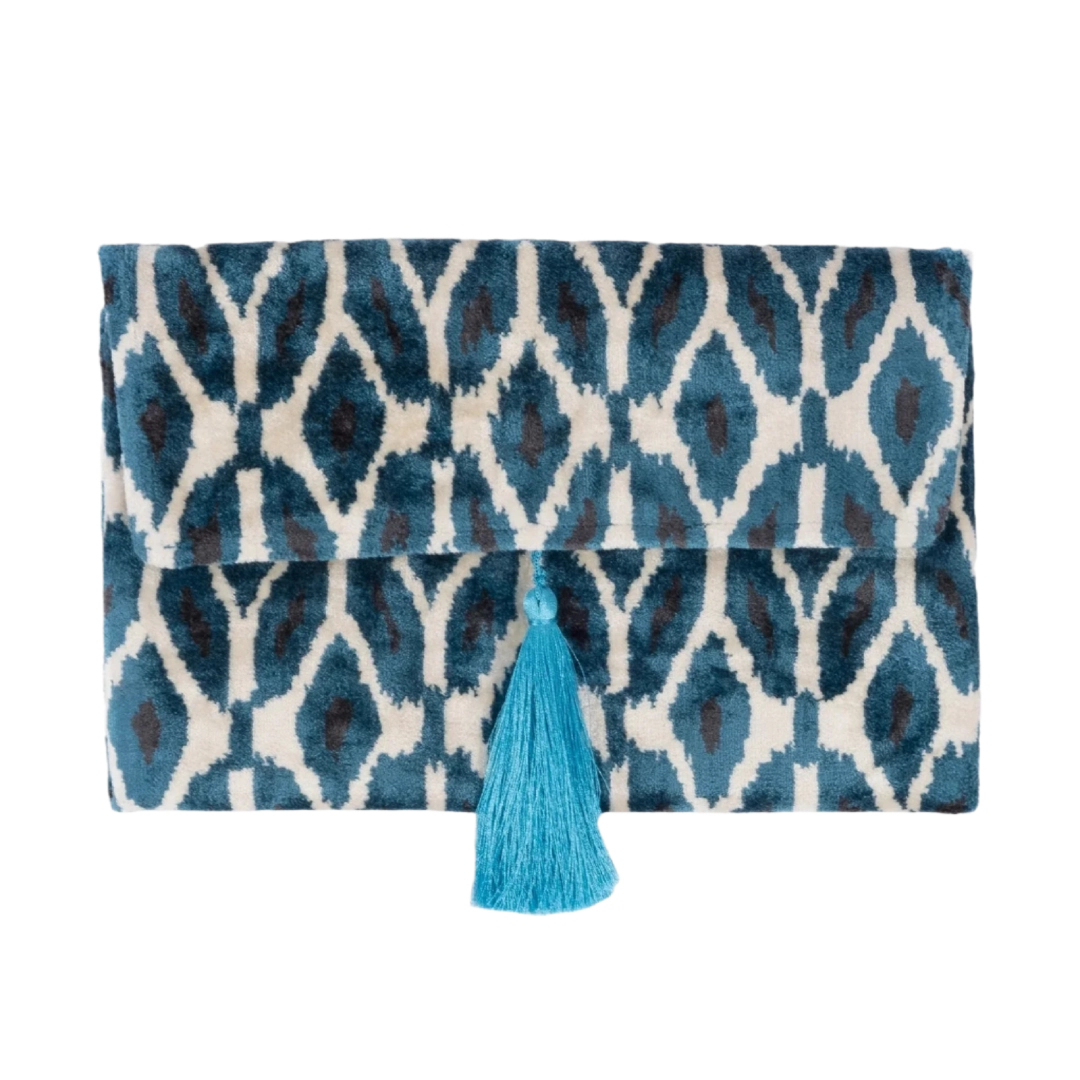 Blue and teal ikat rana petal silk velvet clutch with a bright blue tassel
