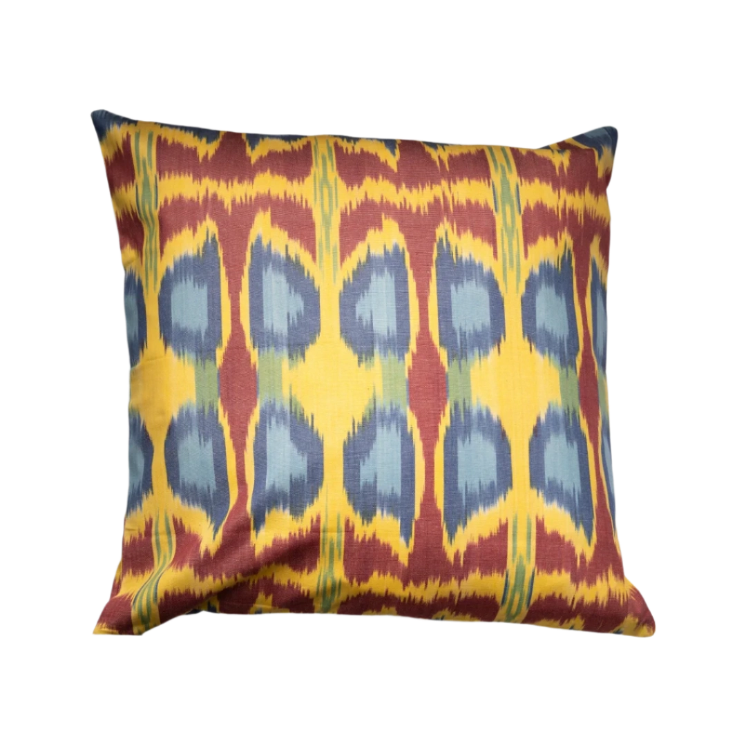 Amber ikat throw pillow cover with slate blue teardrops and berry accents, 20x20