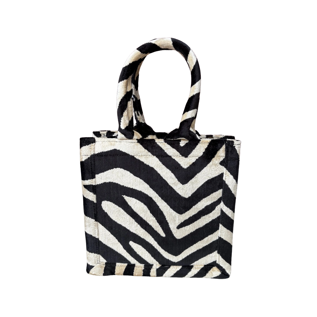 Black and cream zebra stripe silk velvet tote bag with matching handles in the small size, front view