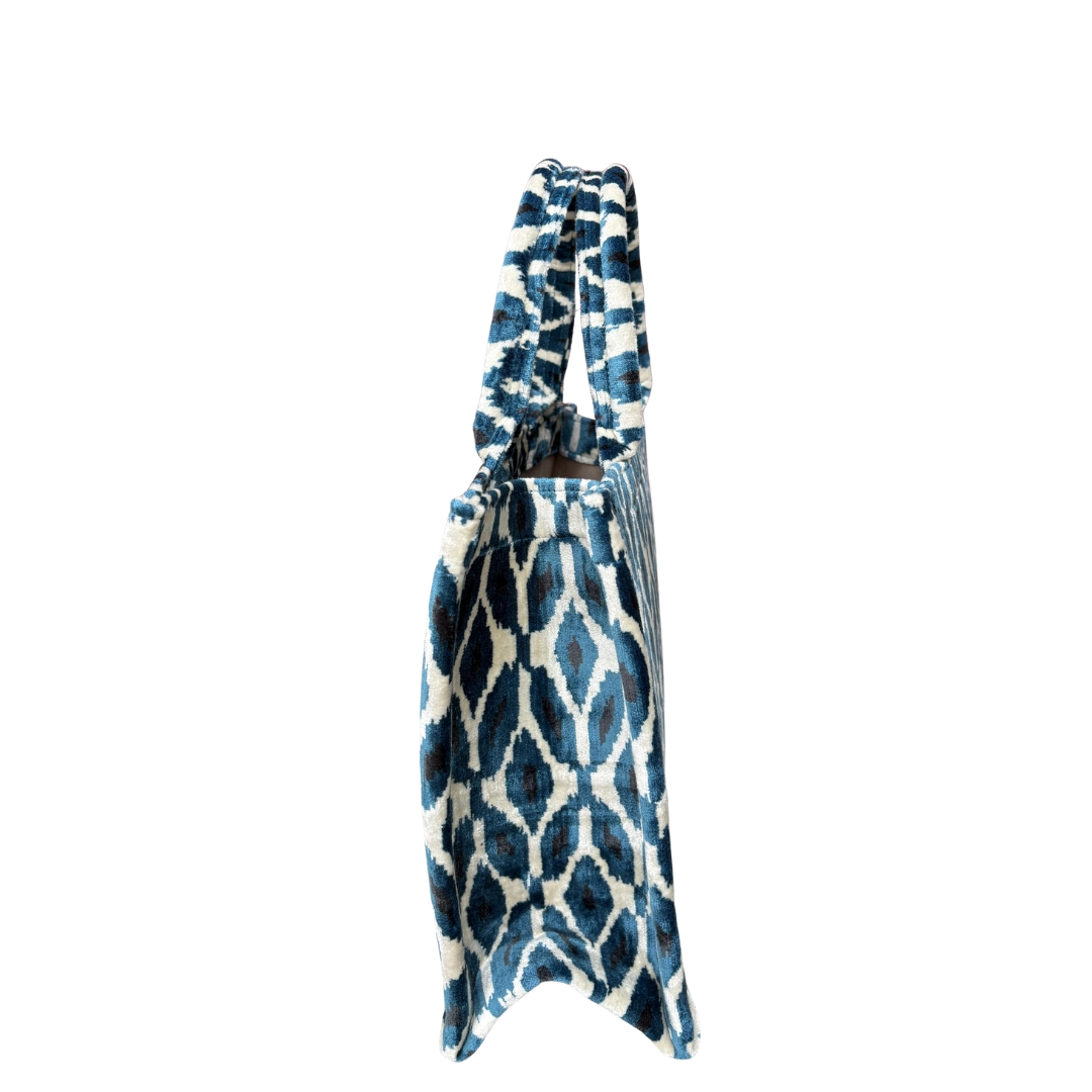 Side view of the Indigo Ikat Diamond silk velvet tote showing its boxy base and gusset