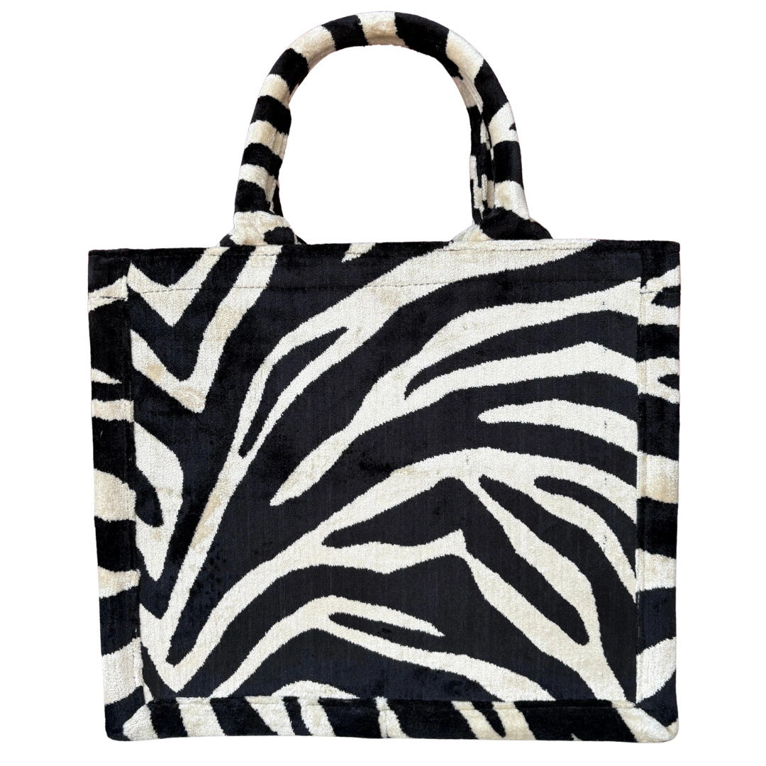 Black and ivory zebra stripe silk velvet tote bag with matching handles, front view