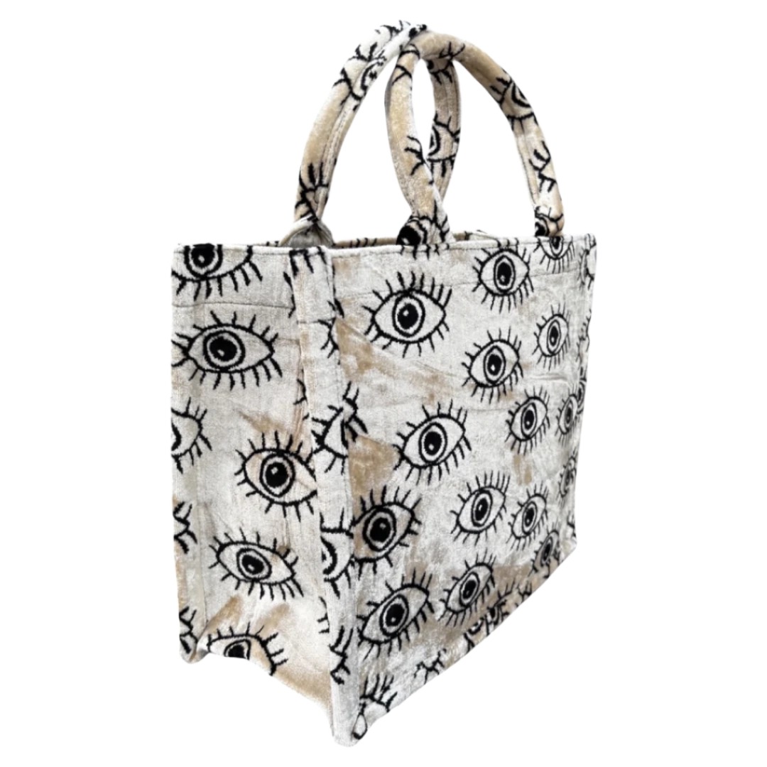 Side view of the Nazar Eye silk velvet tote showing its boxy base and gusset