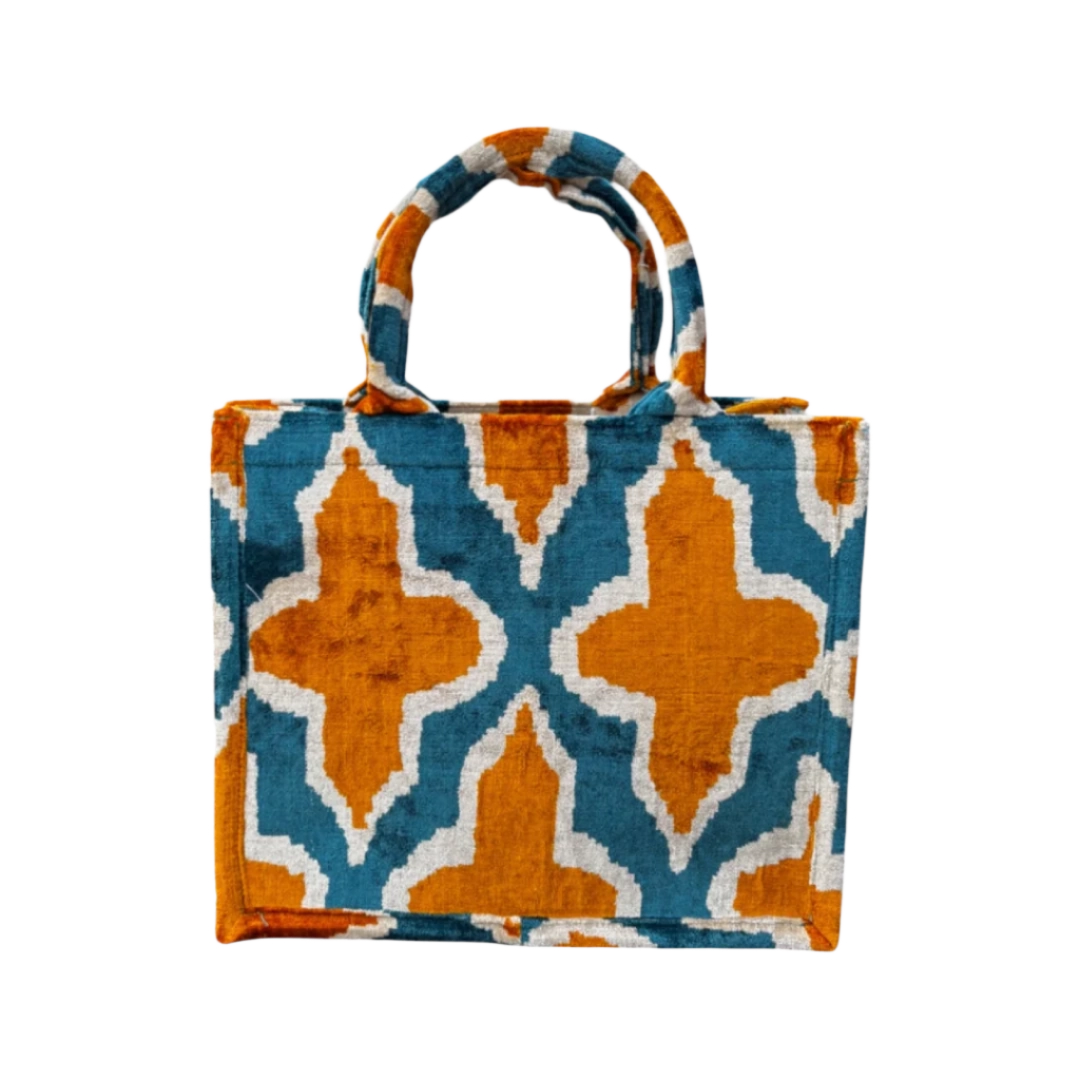 Teal and burnt orange quatrefoil trellis silk velvet tote bag with matching handles, front view