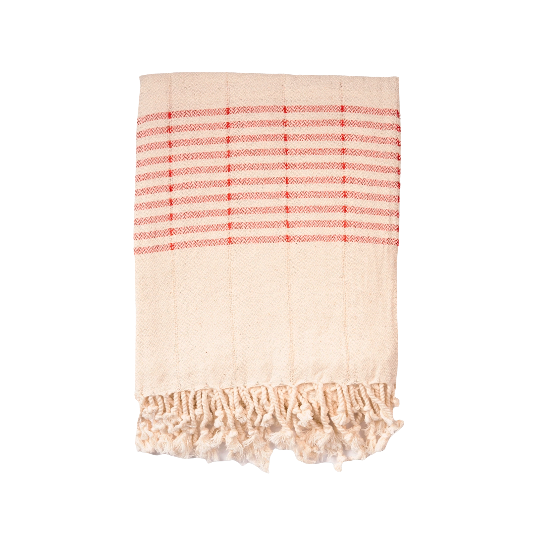 Beige towel with red stripes and frayed edges on a white background