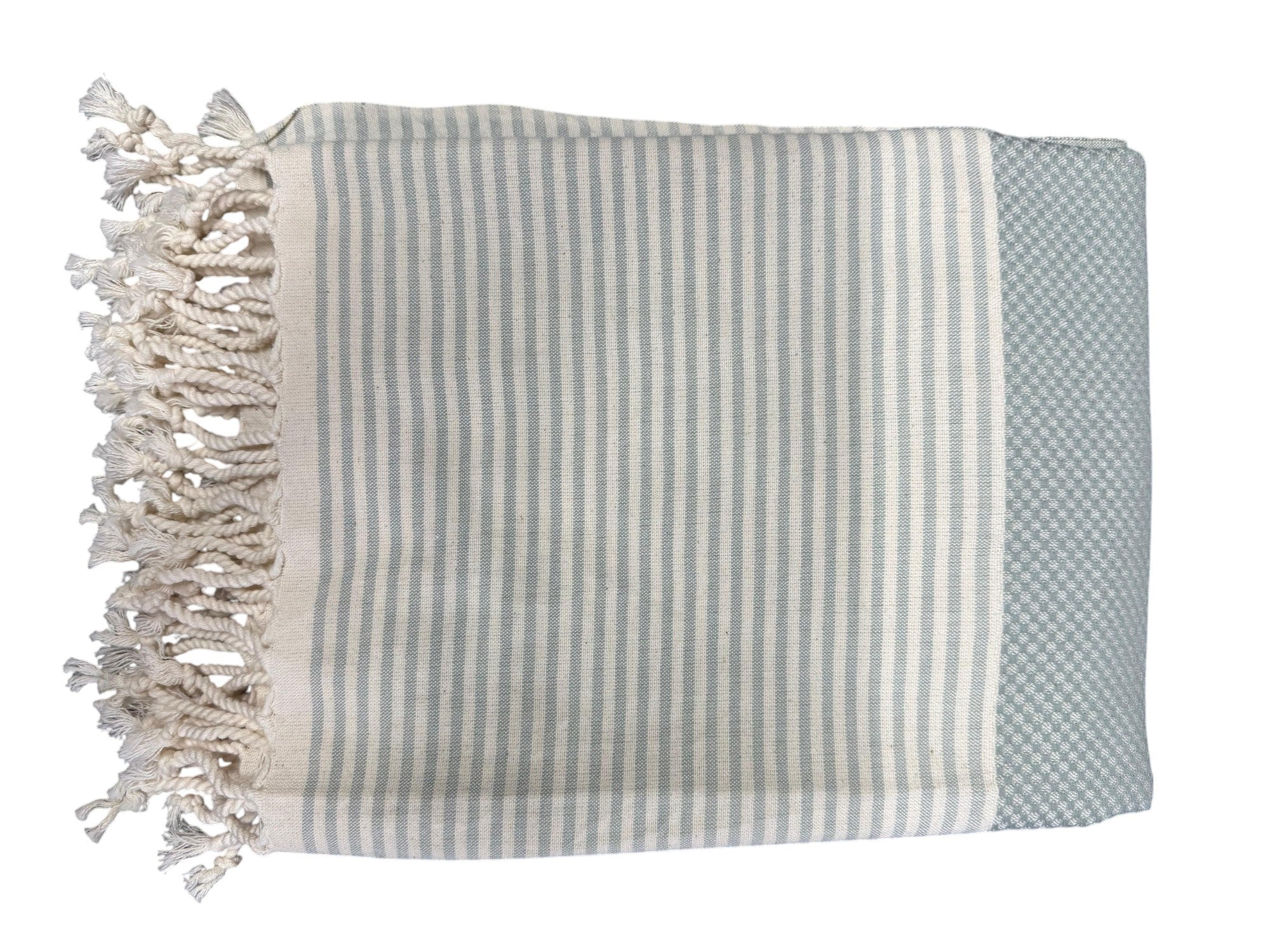 A striped Peshtemal towel in mint waffle color with hand-tied fringes at the bottom corner, made of cotton and linen blend.