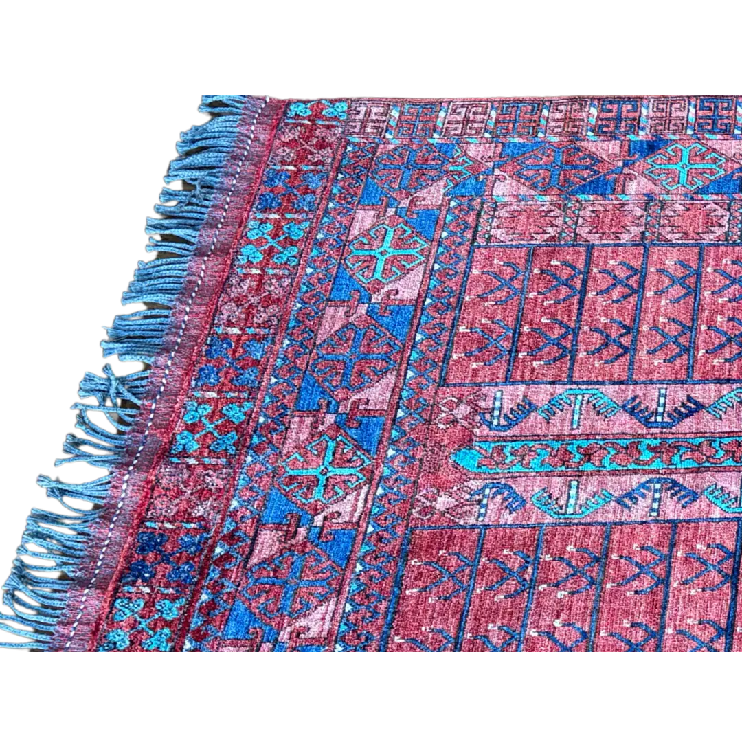 Close-up of a colorful patterned fabric with fringes on a white background