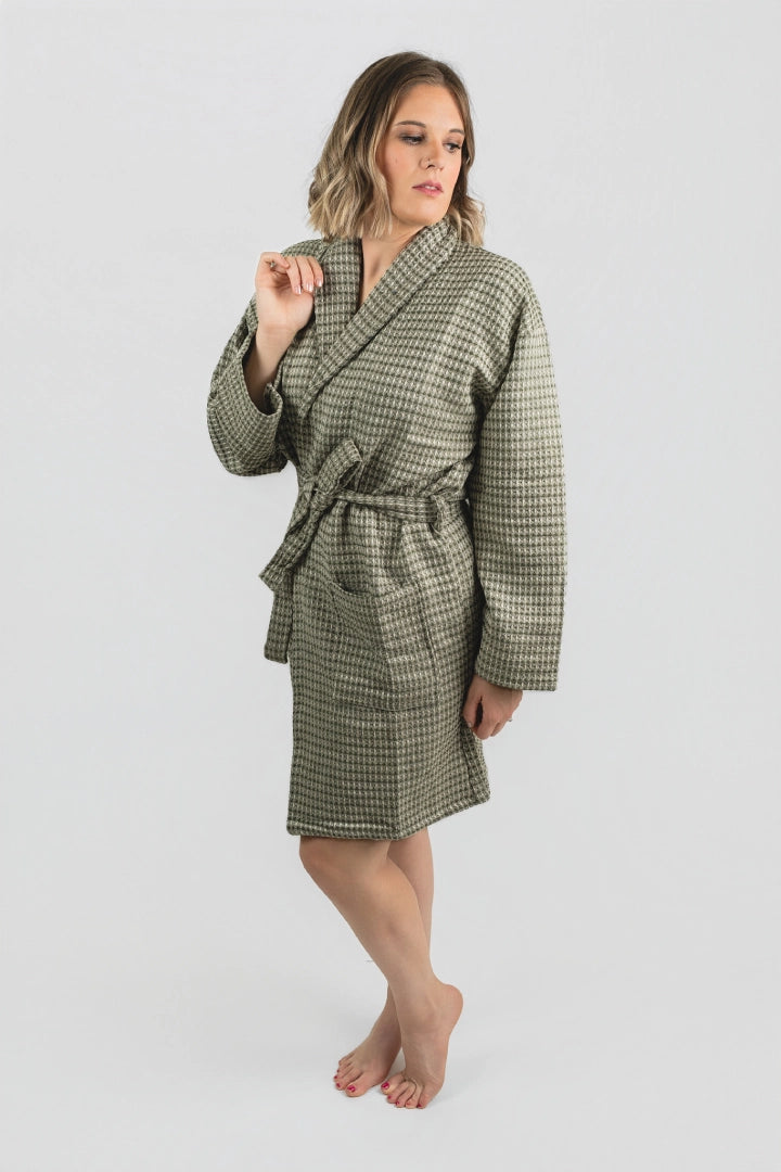 Side view of the Aegean Olive Green waffle peshtemal bathrobe with its shawl collar and tie belt
