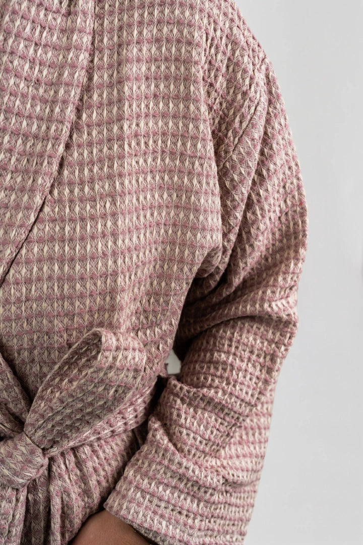Close-up of the honeycomb waffle weave on the Aegean Rose Petal peshtemal bathrobe