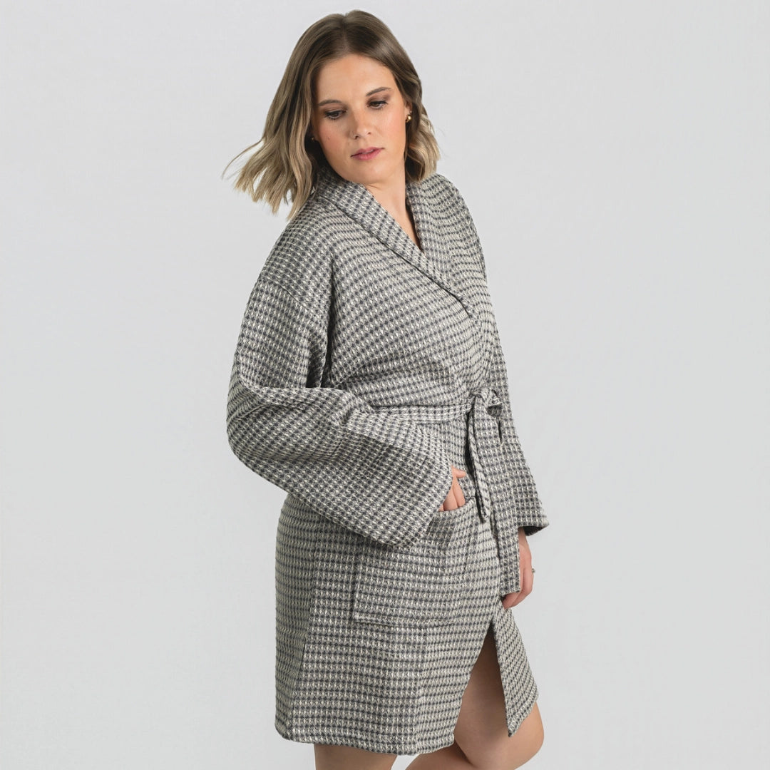Woman wearing the Aegean Stone Gray waffle weave peshtemal bathrobe, front view