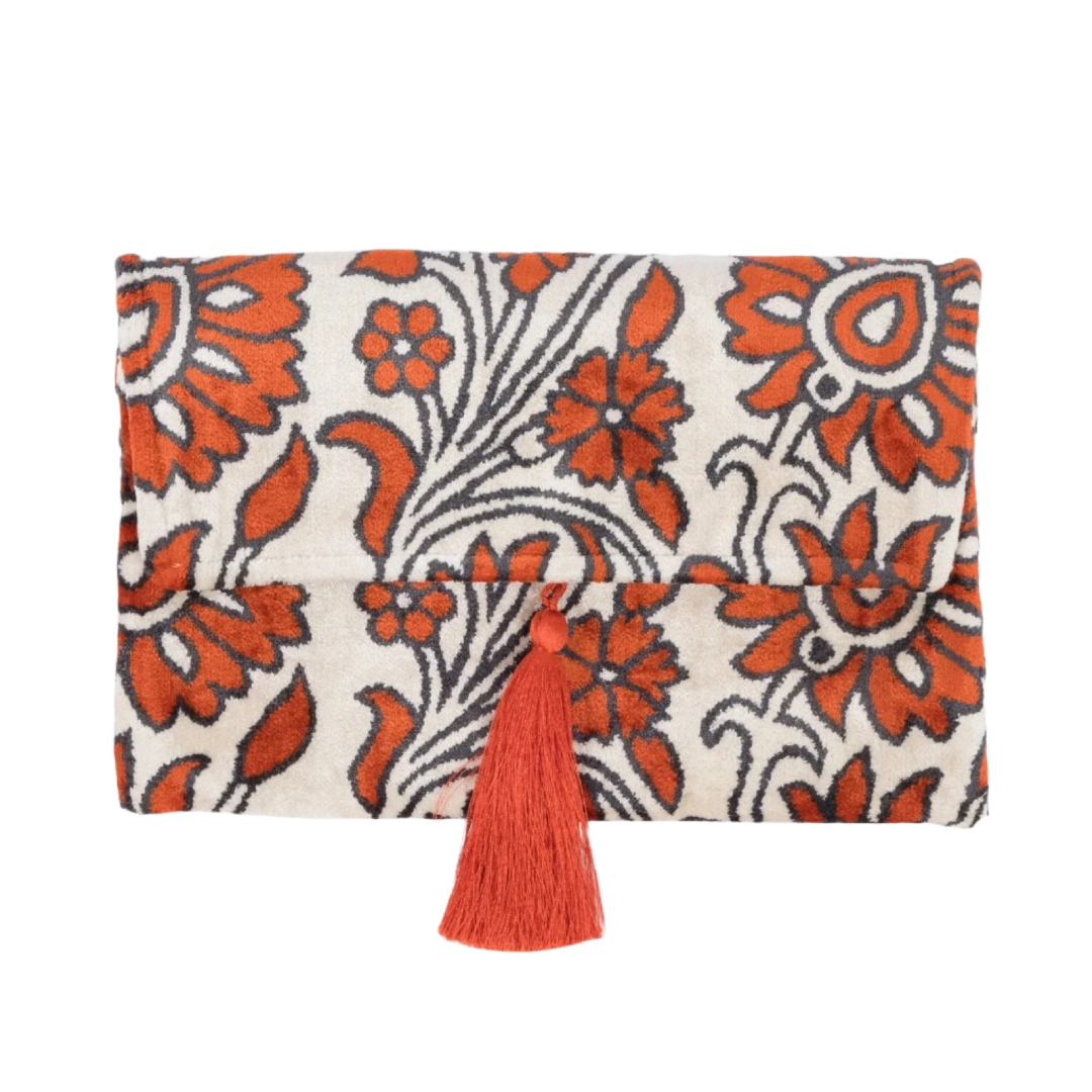 Coral carnations and scrolling stems on an ivory silk velvet clutch with a tassel