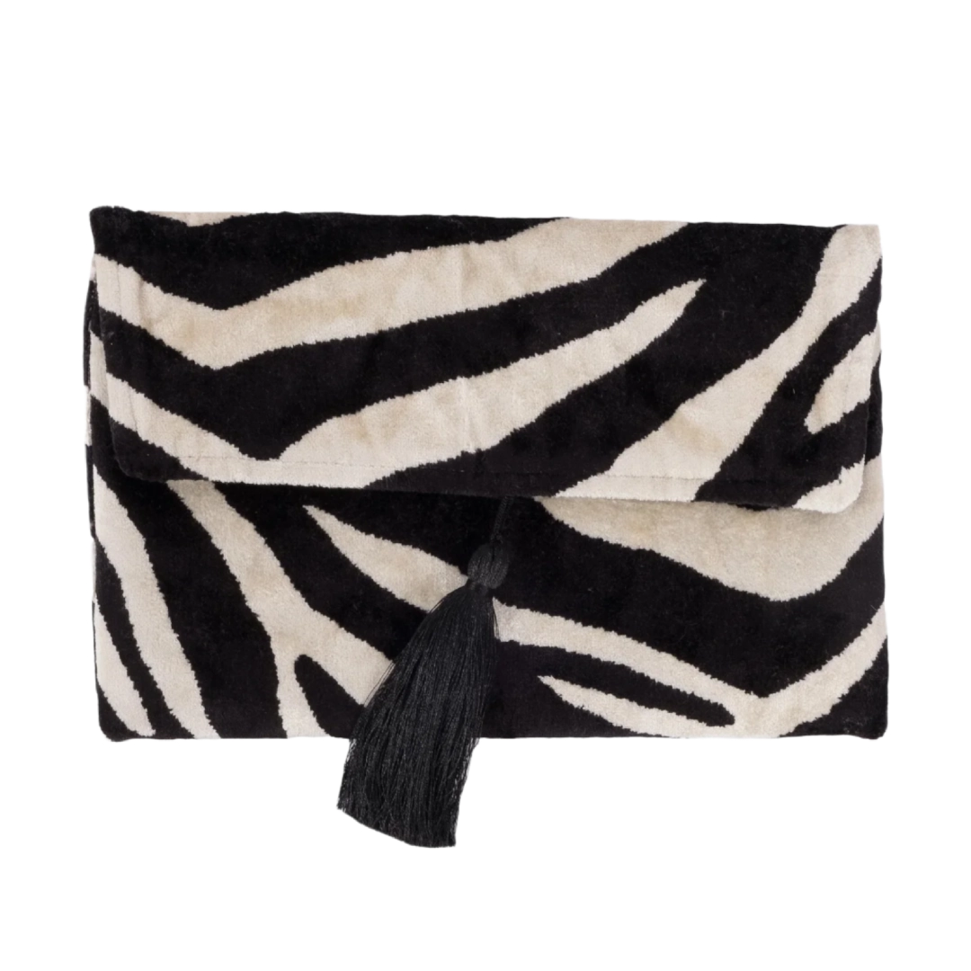 Black and ivory zebra stripe silk velvet clutch with a black tassel, front view