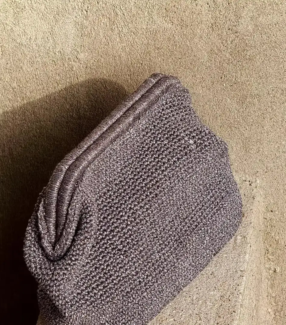 Silver Sabine metallic crochet clutch with a pleated top, front view