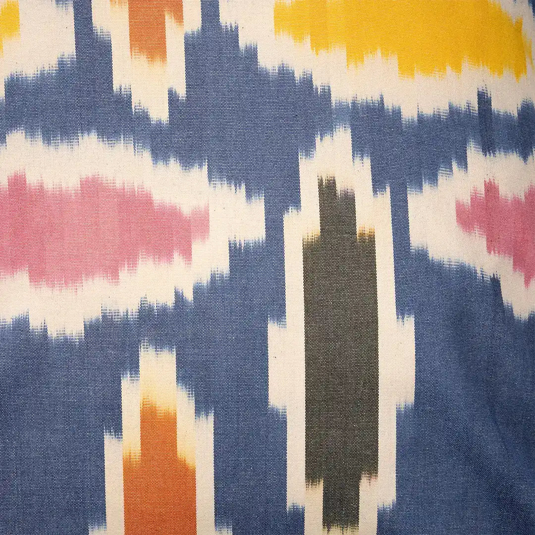 Close-up of the navy ikat weave with its gold and rose leaf shapes