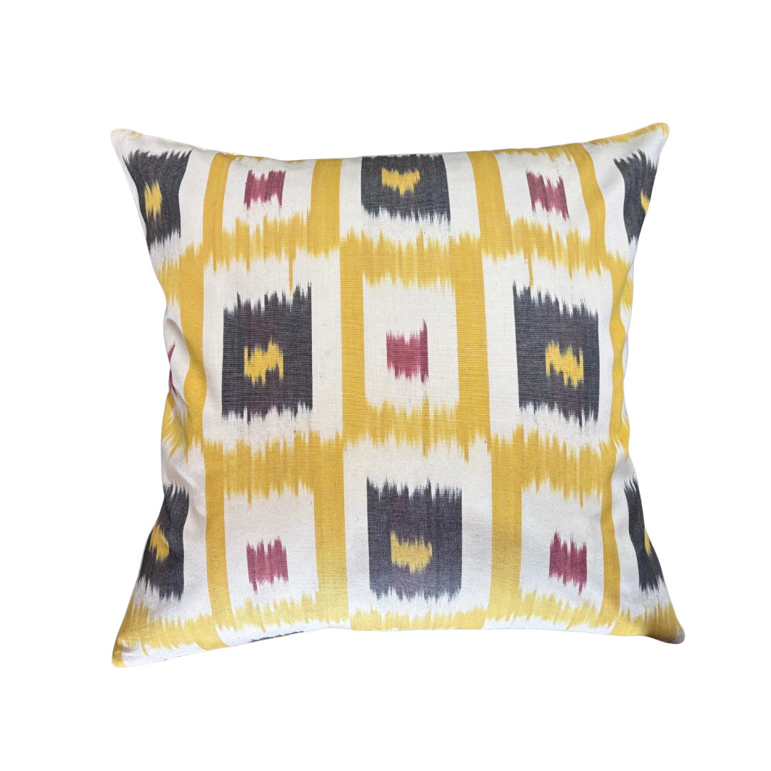 Saffron yellow ikat throw pillow cover set in a charcoal grid, 20x20