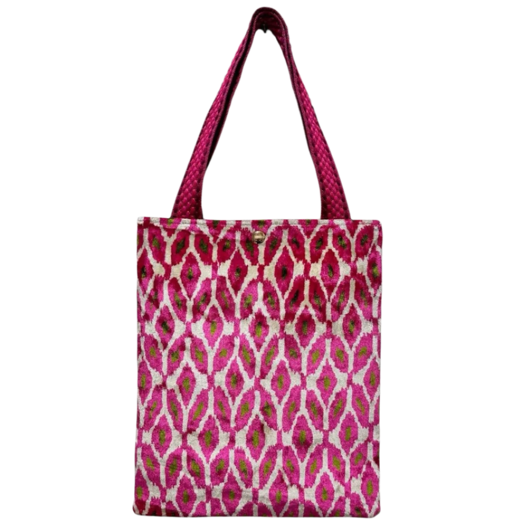 Rose pink ikat diamond silk velvet shoulder bag on a cream ground