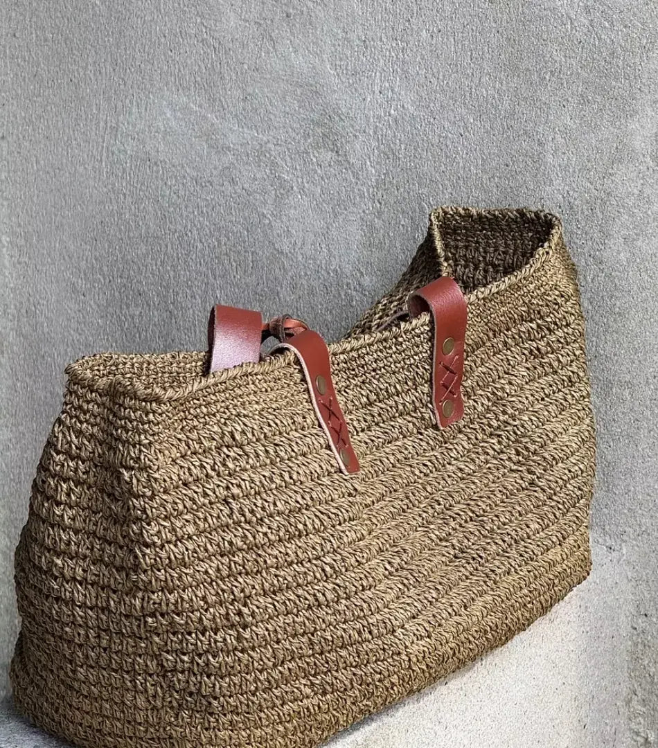 Fall Green raffia tote shown open from above, revealing its roomy unlined interior