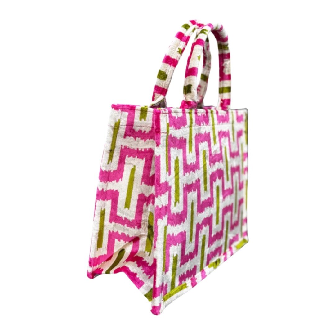Side view of the Fuchsia Labyrinth silk velvet tote showing its boxy base and gusset