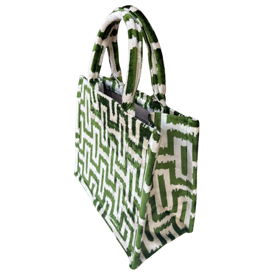 Side view of the Green Labyrinth silk velvet tote showing its boxy base and gusset