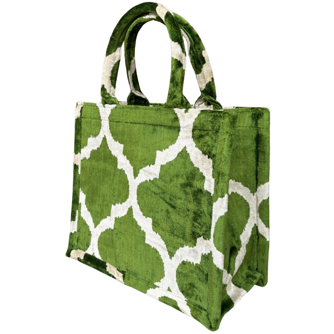 Side view of the Olive Moroccan Trellis silk velvet tote showing its boxy base and gusset