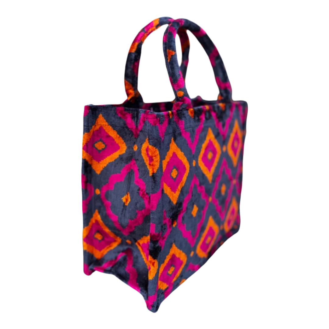 Side view of the Sunset Diamond silk velvet tote showing its boxy base and gusset